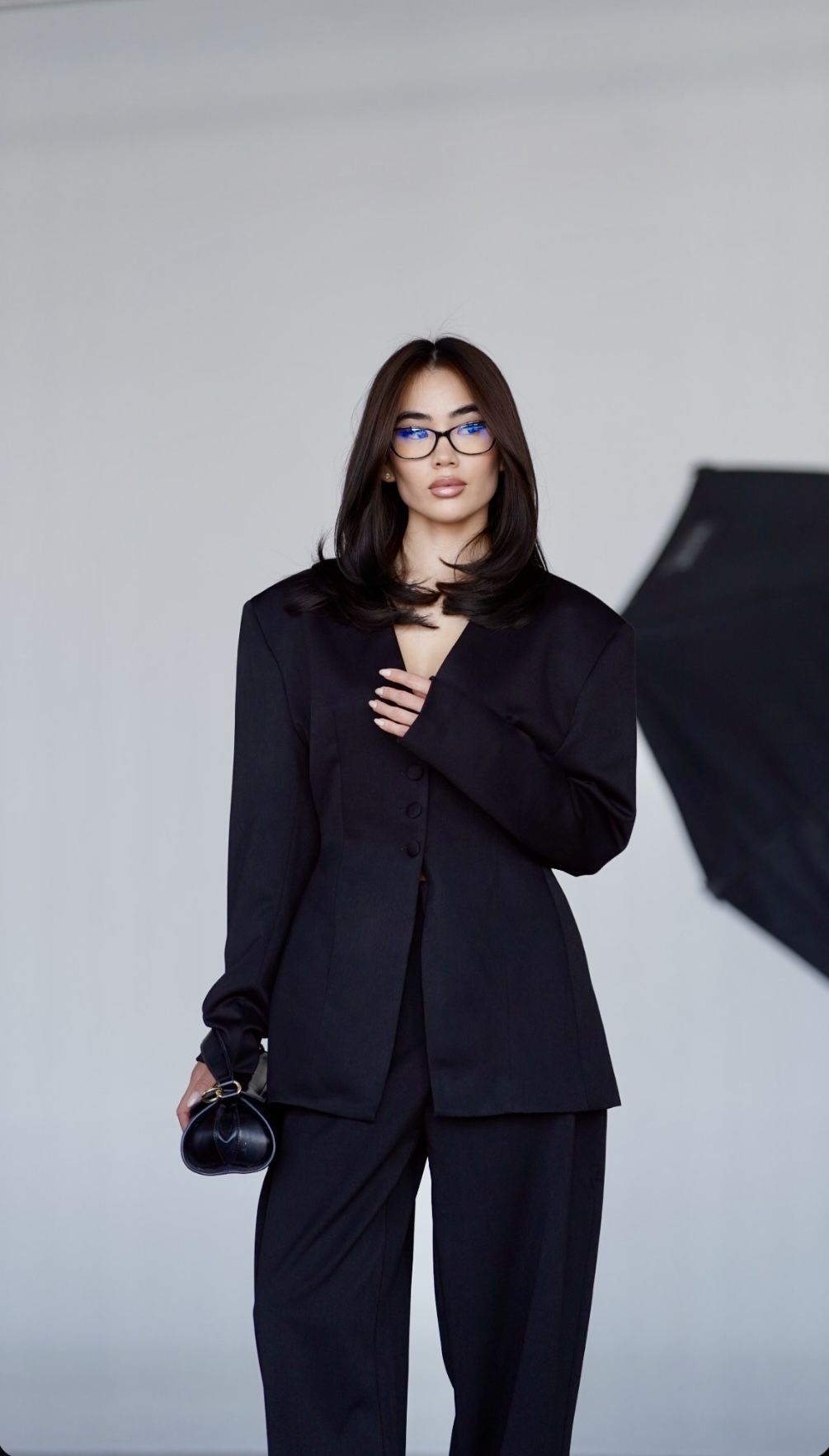 Luxury fashion model in tailored black suit